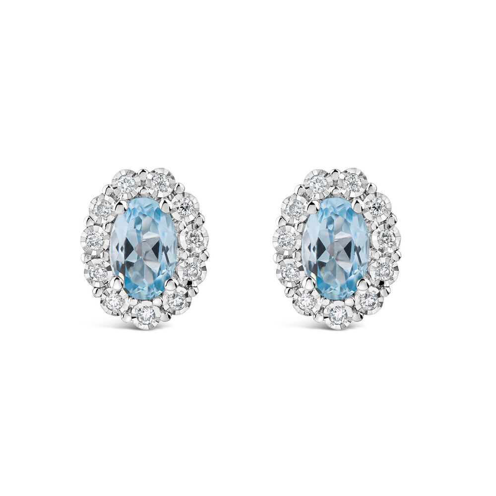 9ct White Gold Oval Blue Topaz Centre 0.05ct Diamond Cluster Stud Earrings
