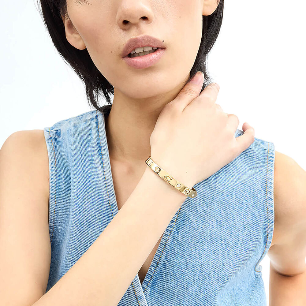 Coach Signature Gold Tone Brass Stone Bangle Bracelet